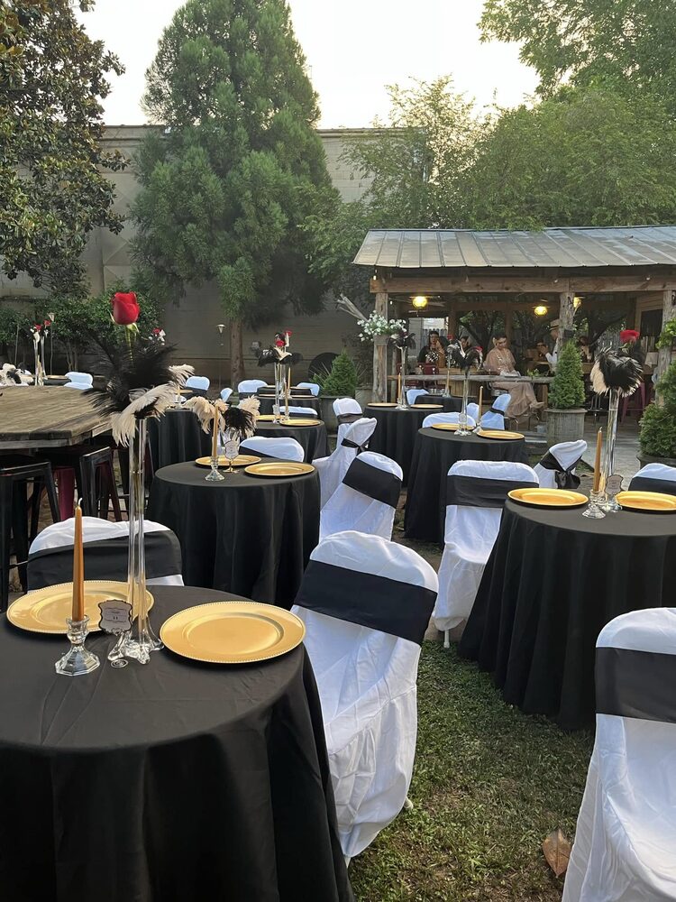 High-top tables set for an event on the patio