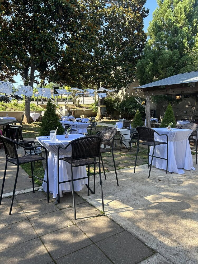 The patio arranged for a daytime gathering