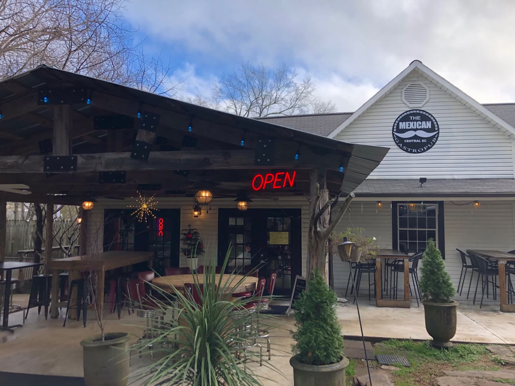 The Mexican at Central exterior with outdoor patio and OPEN sign in Central, South Carolina, five minutes from Clemson