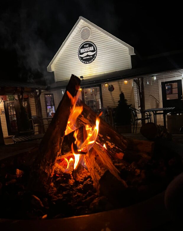The patio and fire pit at The Mexican at Central at night