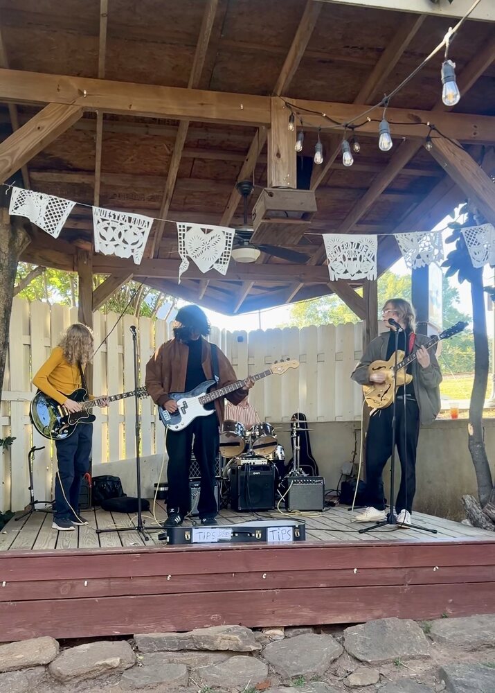 A band performing on the patio stage