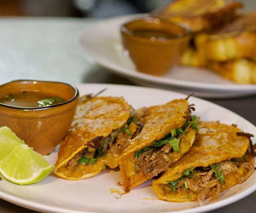 Quesabirria tacos with consommé